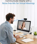 Man using Crisp 1080P Streaming Webcam For Pc And Laptop With Built In Mic on a computer for video calls.