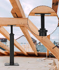 4 Pack Adjustable Floor Jacks For Leveling And Temporary Basement Support in use under wooden beams, telescoping post visible