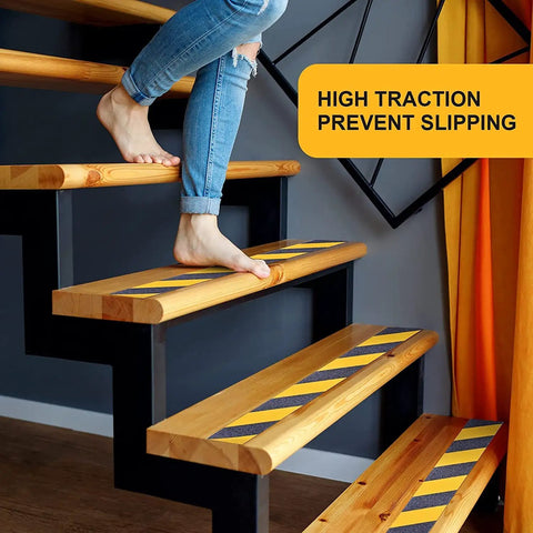 Person walking on wooden stairs with Non Slip Tape Heavy Duty Outdoor Waterproof Safety Tape For Stairs Treads Ramps.