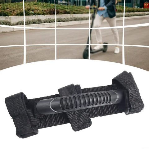 Electric Scooter Hand Carry Straps For M365 Lightweight Canvas Belt And Strap Set With Durable Comfort Grip Easy Grab Handles No Slippage Designed For Quick On The Go Carry Of Your M365 Scooter, featuring black canvas and ABS handle against a blurred background of a person riding a scooter.
