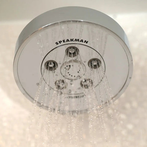Neo Anystream High Pressure Adjustable Shower Head 2.5 GPM Polished Chrome with water flowing in custom spray patterns