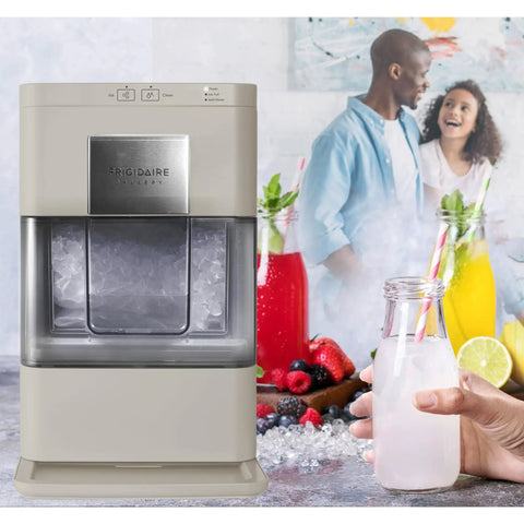 Cream Countertop Nugget Ice Maker With Visible Window And Sleek Touchscreen cranking out soft sonic ice beside beverages.