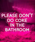 Please Dont Do Coke In The Bathroom Neon Sign With LED Adjustable Brightness in pink color on a fuzzy rug background.