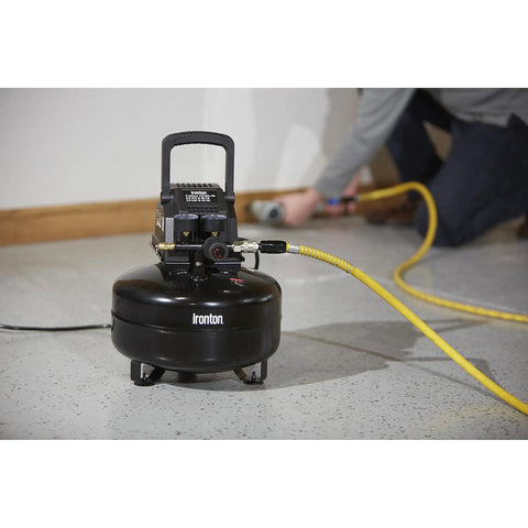 Portable 3 Gallon Air Compressor 0.3 HP 110 PSI Max Pressure Oil Free Pump in use for DIY tasks with yellow hose.