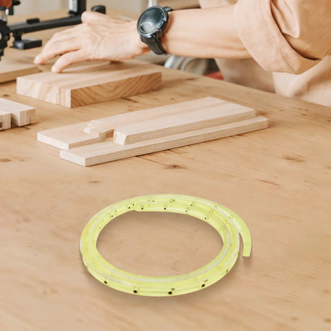 Nail Smooth Curves In Your Woodworking Projects With This Flexible Curve Router Guide Built Tough From Polyurethane And Equipped With Durable Brass Bushings Two Meters Long, displayed on a workbench with wooden planks.
