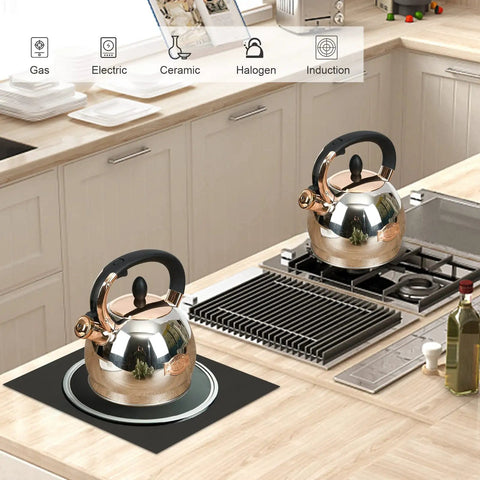 Two Stainless Steel Whistling Tea Kettles With Encapsulated Bottom For Even Heat Distribution 2.8 Quart Quick Boil in a modern kitchen