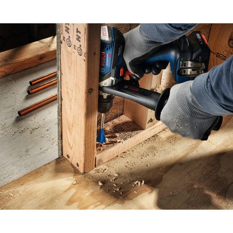 Person using six piece nail killer wood boring bit set with reinforced reamer edges for drilling into nail-embedded wood stud.