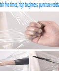 Two Pack Heavy Duty Stretch Wrap Film With Easy Spin Winding Handle And 80 Gauge Self Adhesive Pallet Rolls showing hand gripping film.