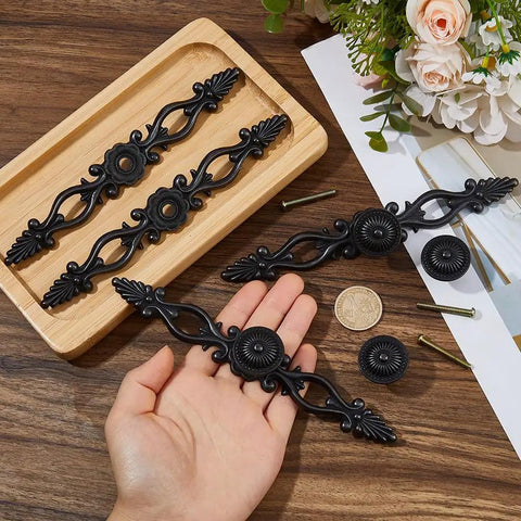 Five Piece Vintage Black Drawer Pulls Set With 0 98 Inch Center To Center Zinc Alloy Cabinet Knobs displayed on table