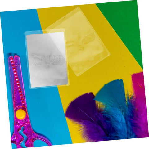 50 Pack Waterproof Card Sleeves With Magnetic Shielding Protectors against scissors and feathers on colorful background