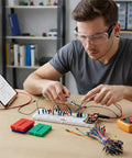 Flexible Wires Included In A Breadboard Kit With 9V Power Module And Dual 5V And 3.3V Outputs For Arduino IoT And STEM Projects Includes 3 Color Coded 170 Tie Point Mini Boards For Quick Prototyping And Easy Debugging. man prototyping on breadboard with wires