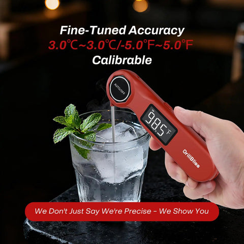 Hand holding Ultra Fast Digital Meat Thermometer For BBQ USB C Rechargeable Kitchen Thermometer in glass with mint and ice