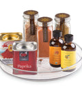 9-Inch Lazy Susan Organizer for Cabinets and Pantries, Grab-And-Go Turntable With One-Hand Access holding spices and extracts