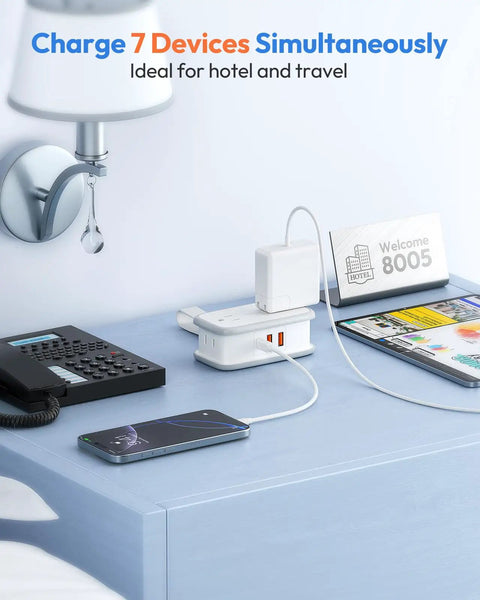 20W Travel Power Strip With 4 Outlets And 3 USB Ports Including USB C 4 Ft Wrapped Extension Cord on hotel desk charging devices