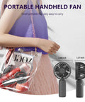 Woman carrying transparent bag with pink accessories and Four Pack USB Rechargeable Mini Handheld Fans Set With 3 Speeds.