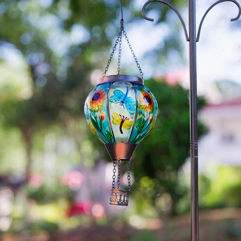 Hot Air Balloon Solar Lantern For Outdoor Use, Dragonfly Inspired Glass Hanging Light For Patio And Garden Decor, suspended in garden