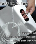 Three Piece Stainless Steel Cutting Board Set With Double Sided Thick Boards being rinsed under water for cleaning
