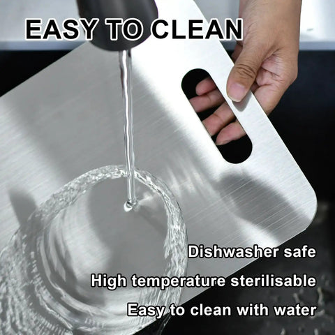 Three Piece Stainless Steel Cutting Board Set With Double Sided Thick Boards being rinsed under water for cleaning