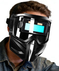 Automatic Welding Helmet With True Color Lens, Safety Cover, And Air Supply Respirator System worn by person in workshop.