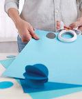 Person using 1 Inch Circle Squeeze Punch For Card Making And Scrapbooking Up To 2x Easier To Punch White And Navy Blue Craft Punch For Embellishments