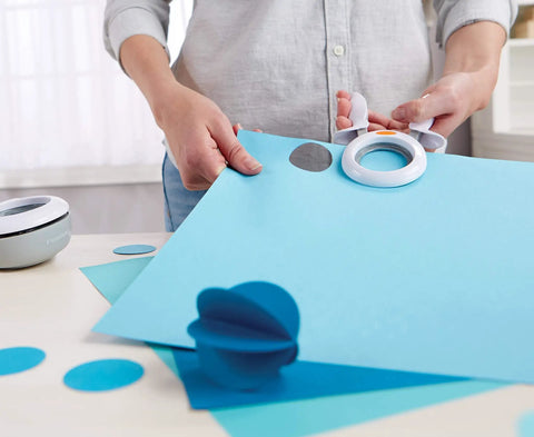 Person using 1 Inch Circle Squeeze Punch For Card Making And Scrapbooking Up To 2x Easier To Punch White And Navy Blue Craft Punch For Embellishments