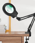 Go-To Desk Magnifier Lamp With Clamp Stand 10X-5X HD Loupe for crafting and reading, attached to desk showing adjustable head.
