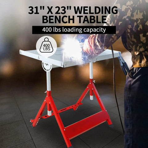 Heavy Duty Welding Table With 400 Lb Capacity, Folding Workbench 31x23 In, in use with sparks visible next to steel top.