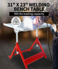 Built Tough Carbon Steel Folding Welding Workbench Table With Adjustable Height And Angles Featuring Three Wide T Slots For Easy Fixture Setup And Rock Solid Four Hundred Pound Capacity, 31" x 23" size with welding in use.