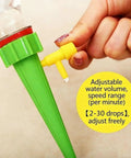 Close-up of a Self Watering Plant Spike Kit For Indoor Plants With Automatic Watering System And Adjustable Flow Slow Release Drip Valve.