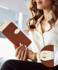 Woman holding a wallet with Colorful 15 Piece Leather Snap Buckles Set For Purses And Bags, featuring a white sew-on button closure.