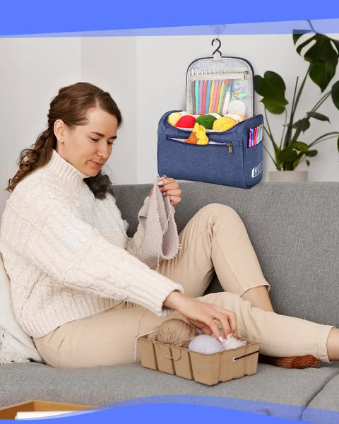 Woman using Beginner Crochet Kit For Adults And Teens With 23 Crochet Tools And 655 Yards Of Yarn Includes Ergonomic Hooks Aluminum Needles Stitch Markers Tapestry Needles Scissors Pom Pom Maker Tape Measure Instruction Booklet And Tote on a sofa.