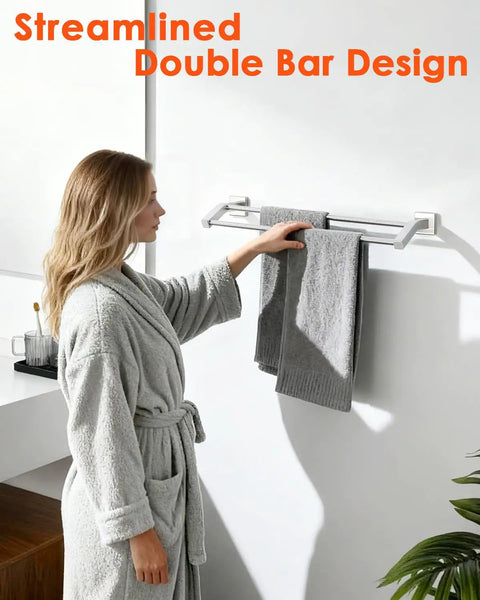 Person using a Heavy Duty 28 Inch Double Towel Bar Wall Mount Towel Rack For Bathroom SUS304 Stainless Steel With Brushed Nickel Finish.