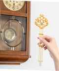 Hand holding DIY Ready Pendulum Clock Movement Replacement For Wall Clocks with gold metal pendulum in vintage setting