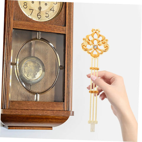 Hand holding DIY Ready Pendulum Clock Movement Replacement For Wall Clocks with gold metal pendulum in vintage setting