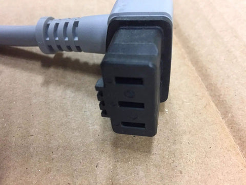 Close-up of Dishwasher Power Cord Replacement For Bosch Thermador Gaggenau showing plug detail on cardboard surface.