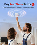 A couple using the easy test/silence button on the No Sweat Photoelectric Smoke Detector for home safety; battery powered.