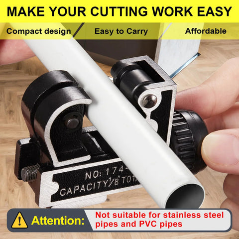 Close-up view of Spurtar mini pipe cutter tool clamping a white PVC pipe; black metal body with knob and roller jaws