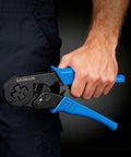 Self-Adjusting Crimping Tool For Square Four-Sided Crimps With Auto Jaw Alignment held in hand, blue handle, pro-grade.