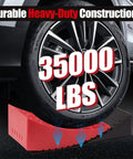 RV Camper Leveling Kit for Dual Axle Rigs with Curved Levelers Ramp under tire, supporting 35000 lbs, in use