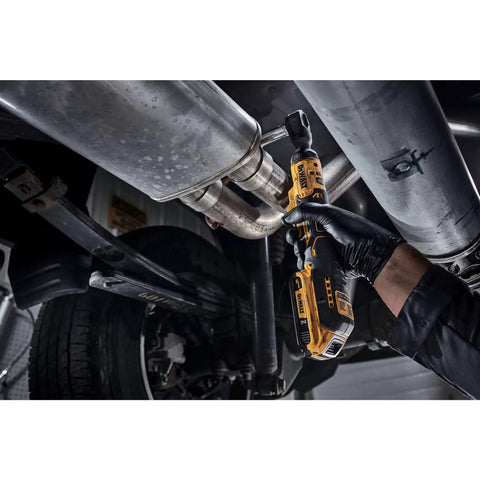 Mechanic using Atomic 20V Max Cordless Ratchet 3/8 Inch Brushless under vehicle exhaust system