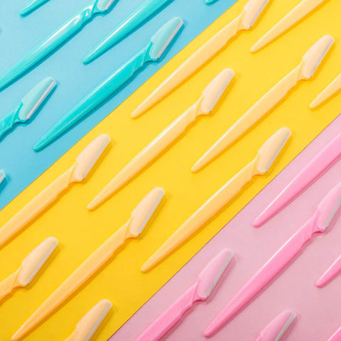 Top Shelf Dermaplane Razor Blade Refills For Ultra Smooth Face Shaving And Gentle Exfoliation With Durable Stainless Steel Eyebrow Shapers For A Flawless Daily Skin Care Routine That Hits Different in assorted colors on a colorful background.