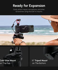 Person using DSLR Style Phone Battery Grip With Built In Power Bank And Qi Wireless Charging at the beach, showcasing mounts.