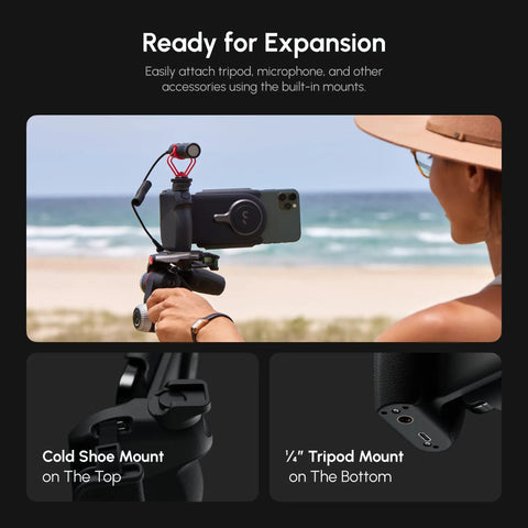 Person using DSLR Style Phone Battery Grip With Built In Power Bank And Qi Wireless Charging at the beach, showcasing mounts.