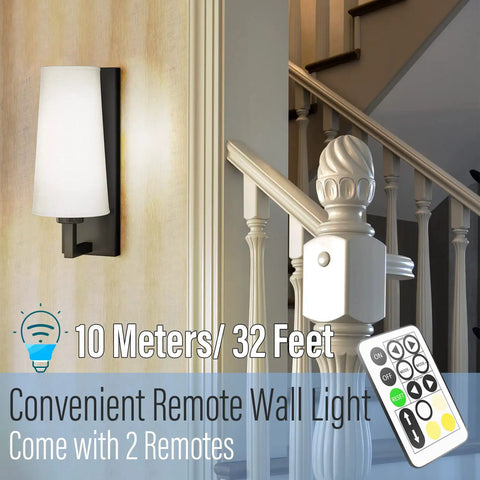 Cordless Two Pack Rechargeable Wall Sconces With Remote, No Drill Installation, shown with remote by a staircase