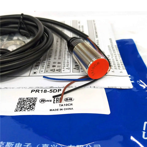 Autonics PR18-5DP Inductive Proximity Sensor M18 5mm Sensing Distance 12-24V DC 3-Wire PNP Output For Industrial Automation Rugged Heavy-Duty Build New 1 Piece, threaded metal body with cable