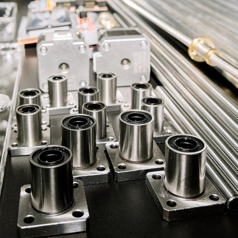 Pro Grade Lmk8Uu Linear Ball Bearings with 8mm bore and 15mm outer diameter on a work surface.