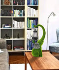 Living room setting with Super Cool Outdoor Elephant Garden Statue Resin With Solar Light For Yard Patio Balcony, green finish.