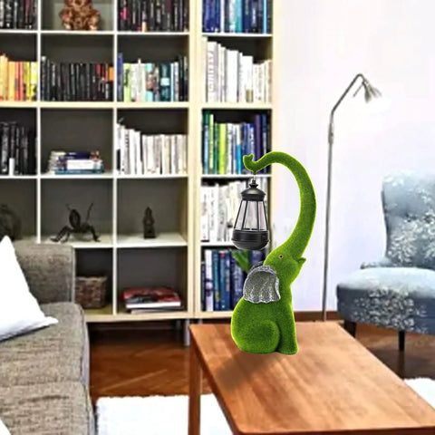 Living room setting with Super Cool Outdoor Elephant Garden Statue Resin With Solar Light For Yard Patio Balcony, green finish.