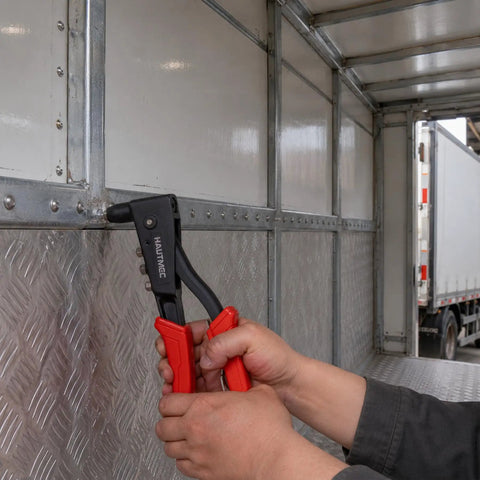 Heavy Duty Pop Rivet Gun Kit Workhorse With 120 Pieces Rivets And 4 Interchangeable Heads in use on metal panel