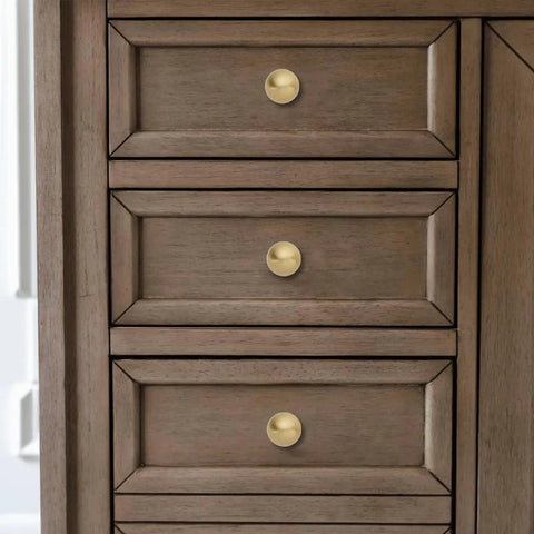 Top Shelf 10 Pack Solid Brass Cabinet Knobs Sleek Round Ball Hardware With Slick Brushed Gold Finish on wooden dresser drawers.